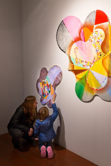 People viewing Robert Straight's paintings in the Old College Gallery at the University of Delaware