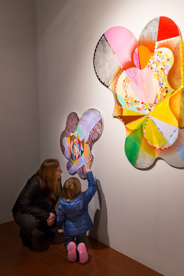 People viewing Robert Straight's paintings in the Old College Gallery at the University of Delaware
