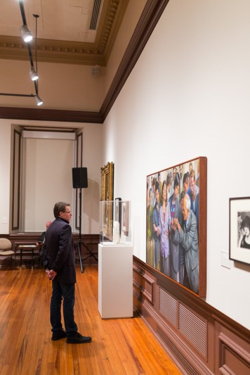 Person viewing art in the Old College Gallery at the University of Delaware