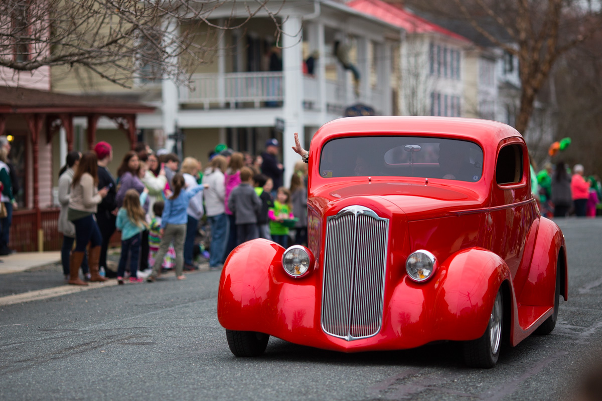 A red classic car from the parade